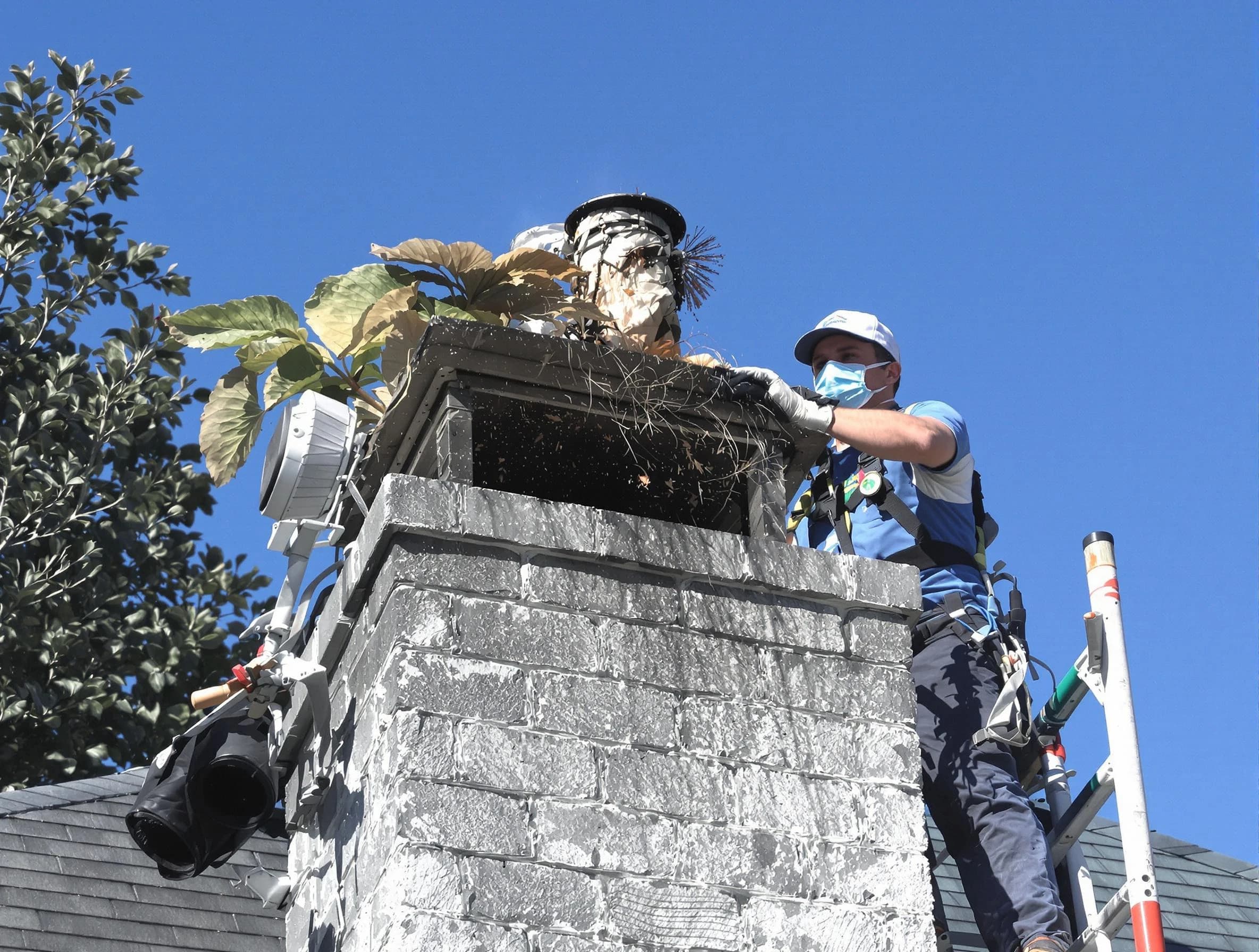 Lakewood Chimney Sweep specialist performing chimney cleaning in Lakewood, NJ